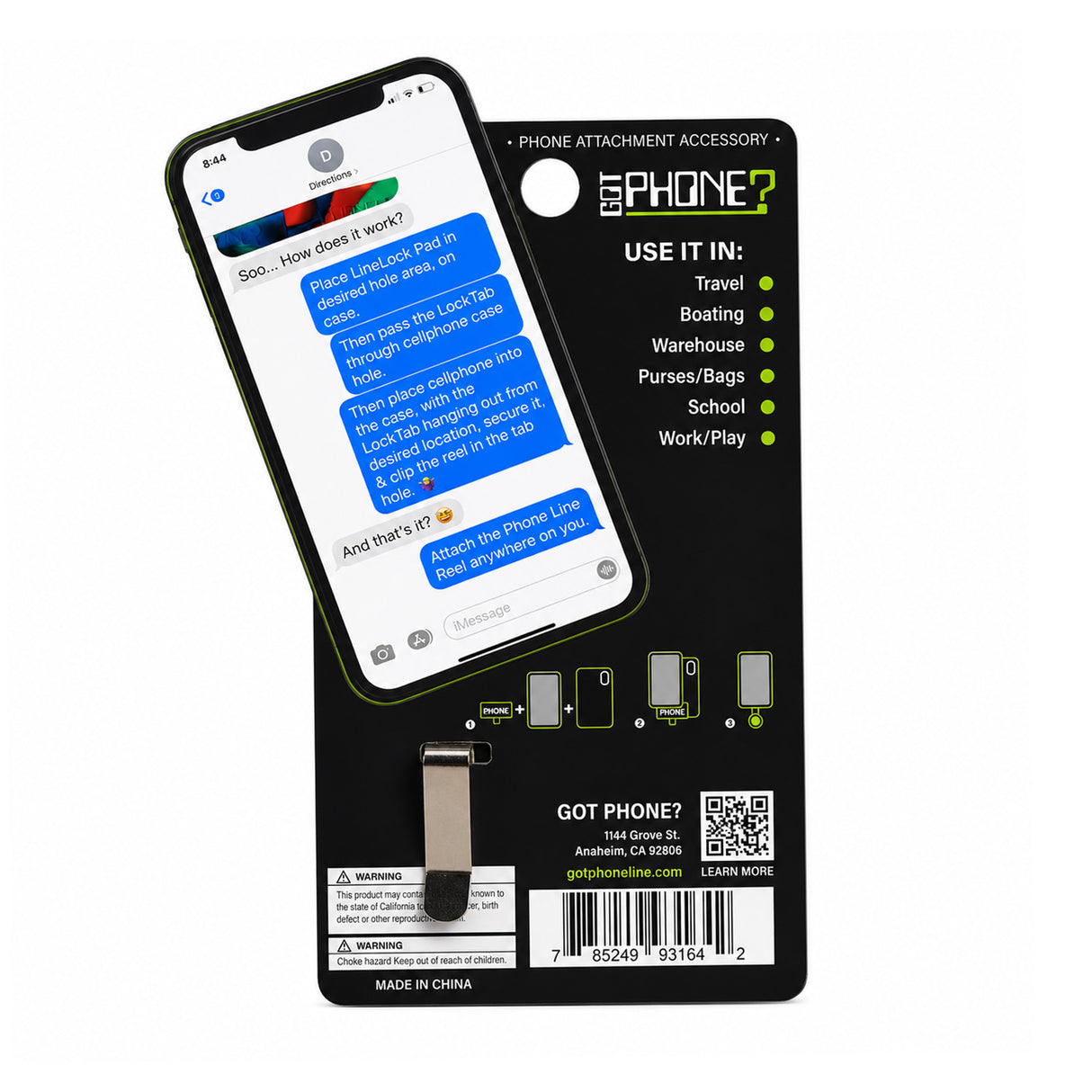 A GOT PHONE? brand phone attachment accessory displayed on its black retail backing card. The product is a small black metal clip designed to attach to a phone case, shown alongside a smartphone with a green case displaying a messaging screen.